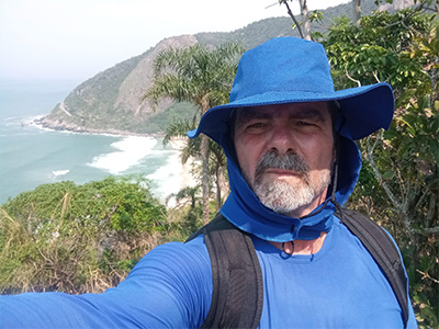 Tour Guide Gus with a hidden beach in the background.